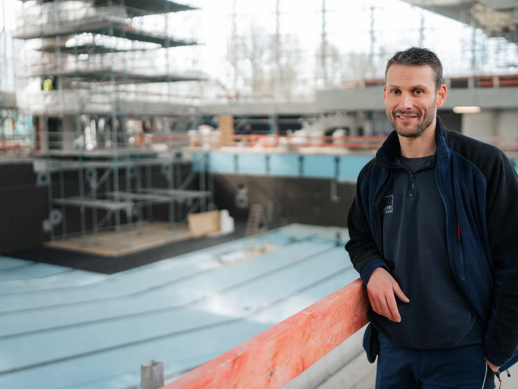 Elevator fitter on construction site