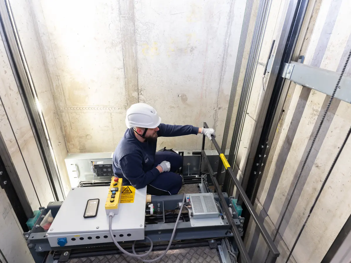 Technician repairs an elevator